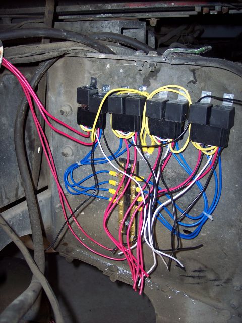 1981 Kenworth W900A - Close-up view of a complex wiring harness multiple relays and a terminal block, likely part of a truck's electrical system.