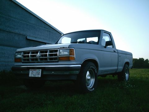 2001 Dodge 2500 - Ford Ranger pickup truck with a chrome grille and aftermarket wheels.