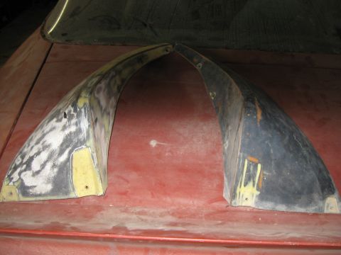 1979 Chevrolet Camaro - Two fender flares, likely for a classic car, are shown with primer and body filler applied to one of them.