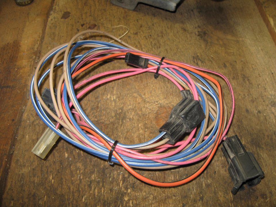 Wiring harness with multiple colored wires and black connectors