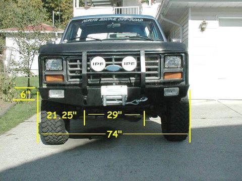 1985 Ford Bronco - Modified front end of an older Ford Bronco, likely from the early 1980s, off-road accessories.