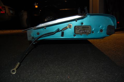 1994 Ford Bronco - Close-up of a car door latch mechanism, possibly from a Ford Bronco.