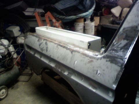 1979 Ford Bronco - Quarter panel and bed of a 1978 Ford Bronco undergoing repairs in a garage.