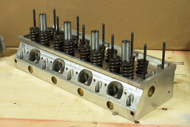 Aluminum engine cylinder head with multiple valves and springs visible