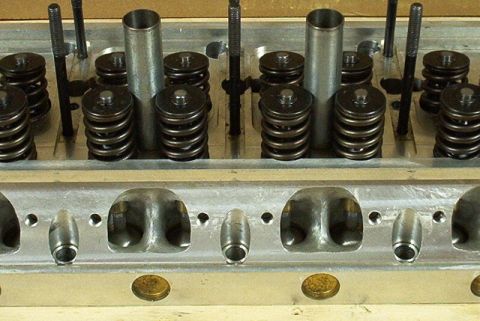 1972 Ford Ranchero - Close-up view of an engine's cylinder head, showing internal components like valves and springs.