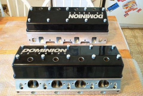 1972 Ford Ranchero - A pair of Dominion 32 valve cylinder heads are displayed on a table.