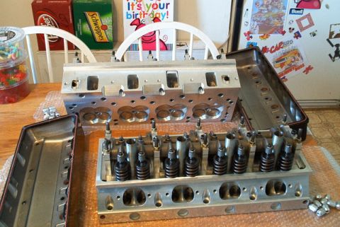 1972 Ford Ranchero - Engine cylinder heads are laid out on a table, disassembled with valves and springs visible.