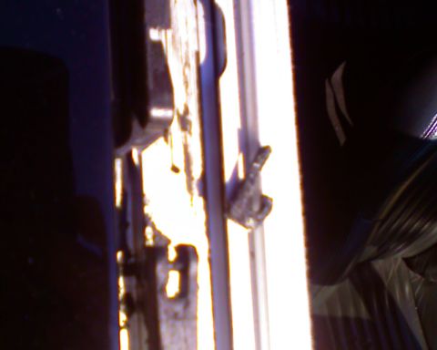 2002 Chrysler 300M - A close-up view of a car's interior door latch mechanism, with the Supermotors logo visible at the bottom right.