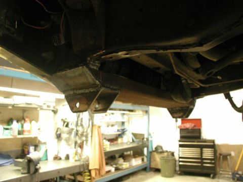 1985 Ford Bronco - Custom chassis modifications are visible on the underbody of a vehicle, suggesting aftermarket suspension work.
