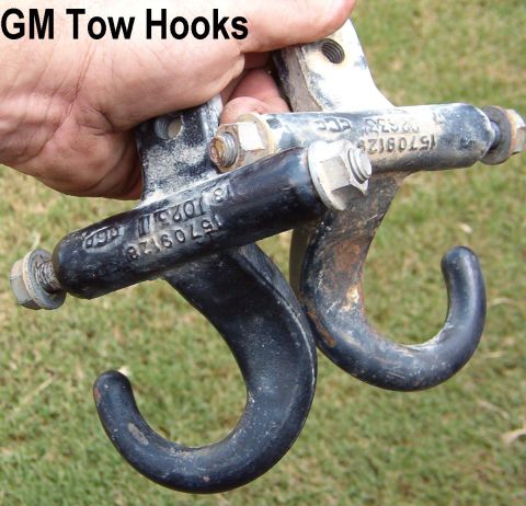1983 Ford Bronco - GM Tow Hooks (cast iron) w/all OE fasteners 106mm across (4.17") Main bolt slips through straight across; rear bolt is short.