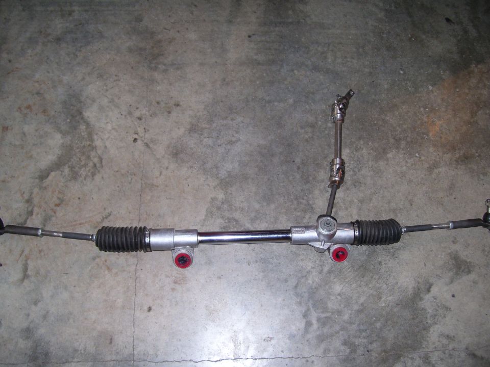steering rack and pinion assembly with tie rods and bellows