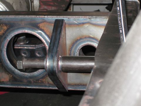 1995 Ford Bronco - Custom fabricated steel bracket with a bolt, likely for a vehicle modification.