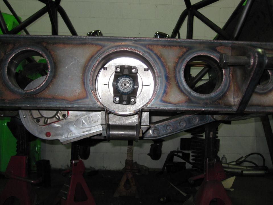 Custom differential housing with 'ATLAS' visible, mounted on jack stands