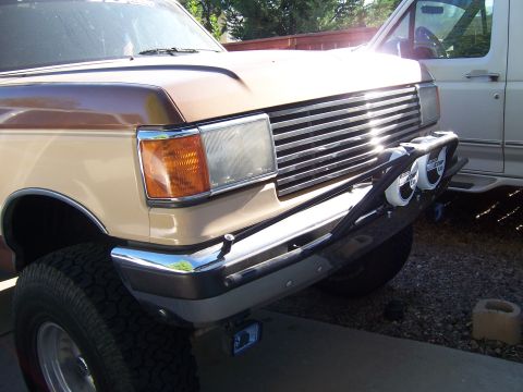1990 Ford Bronco - Front view of a 1990 Ford Bronco showing its grille and bumper details.