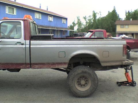 2001 Ford F-350 - This Ford F-series truck is being worked on, with a jack supporting the rear axle.
