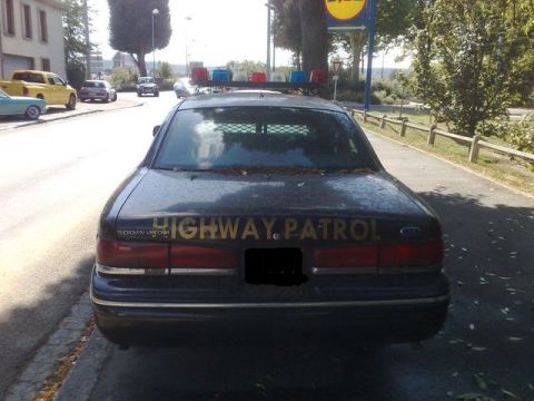 1991 Ford Crown Victoria - This 1991 Ford Crown Victoria served as a Highway Patrol vehicle, identifiable by its distinctive light bar and markings.