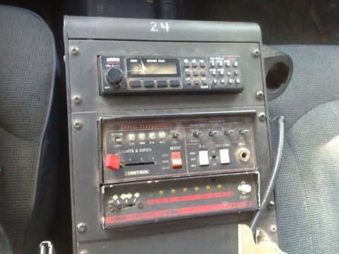 1991 Ford Crown Victoria - This photo shows the interior control panel of a police vehicle, communication and lighting equipment.