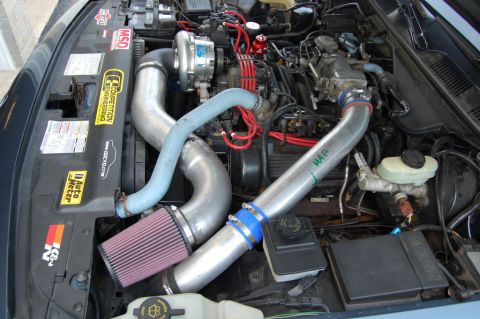1985 Mercury Grand Marquis - Customized engine bay a turbocharger, K&N air filter, and prominent intake piping.