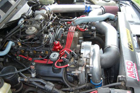 1985 Mercury Grand Marquis - Customized engine bay a supercharger and performance ignition parts.