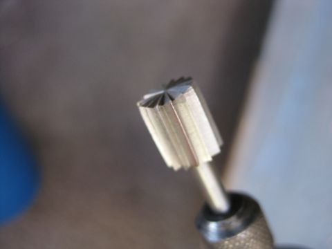 1995 Ford Bronco - A close-up shot shows a rotary tool bit, likely used for grinding or cutting.