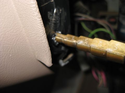 1995 Ford Bronco - Close-up of a tool used for dash repair in a 1995 Ford Bronco, showing measurement markings.