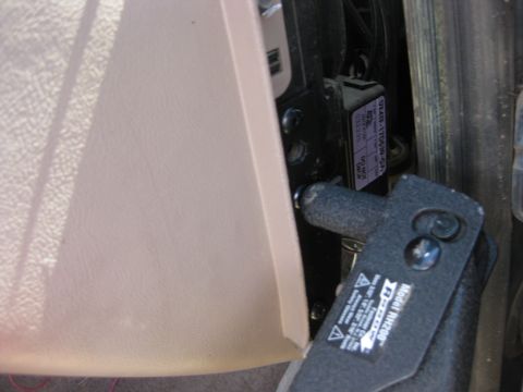 1995 Ford Bronco - A black metal bracket with model number RH200 is attached to the vehicle's interior panel.