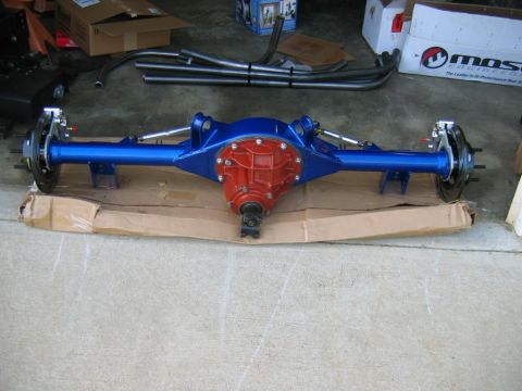 1992 Ford Mustang - A custom rear axle assembly, painted blue and red, sits on a cardboard base.