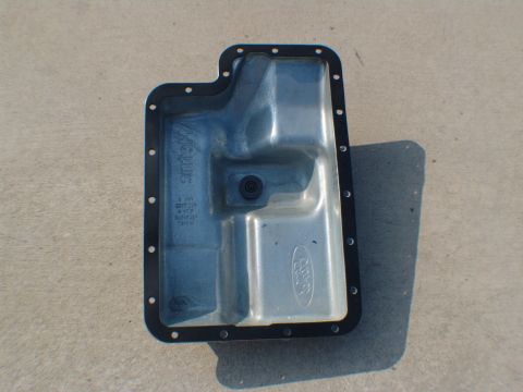 1996 Ford Bronco - Ford transmission oil pan with "METRIC" and Ford logo stamped on it.