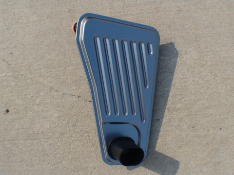 1996 Ford Bronco - Transmission filter shown resting on a concrete surface.