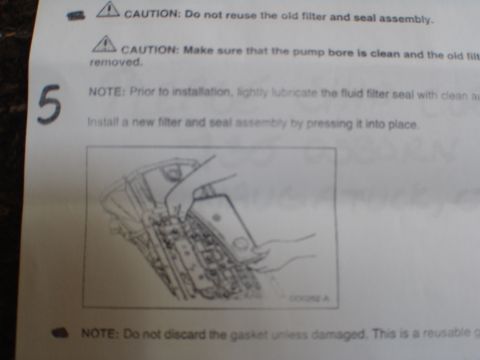 1996 Ford Bronco - Diagram illustrates the process of installing a new transmission filter and seal assembly, accompanied by important caution and note adviso…