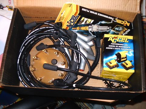 1996 Ford Bronco - Box of Accel performance spark plug wires and ignition coils, ready for installation.
