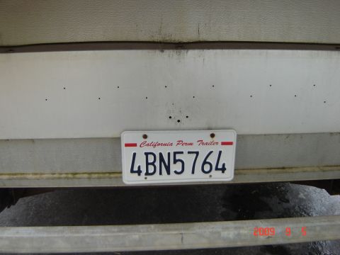 1993 Ford Bronco - A California license plate is attached to the rear of a trailer.