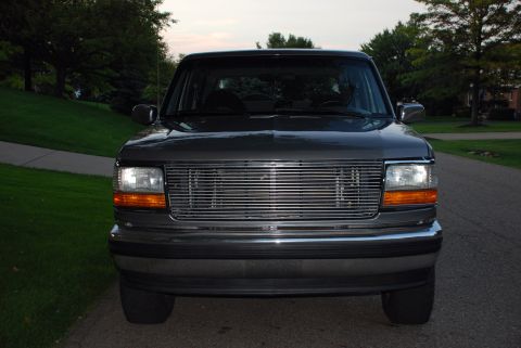 1995 Ford Bronco - Front view of a dark gray 1995 Ford Bronco, its chrome grille.