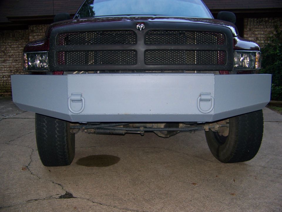 Gray aftermarket front bumper with tow hooks on a 2001 Dodge 1500