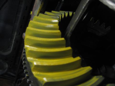1995 Ford Bronco - Differential gears are visible in this close-up shot, showing yellow teeth meshing with black ones.