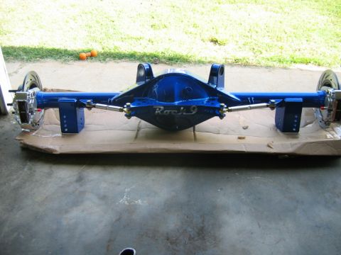 1992 Ford Mustang - A custom blue rear axle assembly, labeled 'Rock 9', is shown in a garage setting.