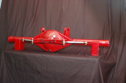 1992 Ford Mustang - A red rear axle assembly with "Rock 9" branding is displayed against a dark brown backdrop.