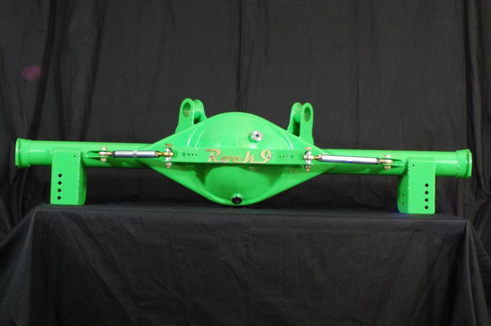 Green rear axle assembly with "Rock 9" lettering