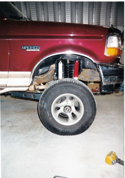 1996 Ford Bronco - Close-up of the front suspension and wheel assembly on a 1996 Ford Bronco.