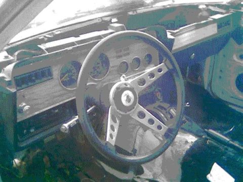 1978 Ford Mustang II - The interior of a 1978 Ford Mustang II, with a focus on the dashboard and steering wheel.