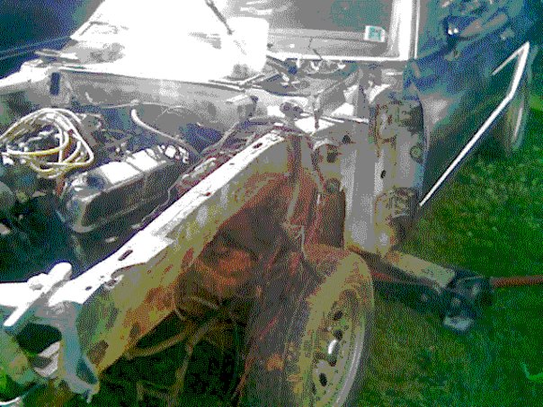 1978 Ford Mustang II engine bay with exposed engine and rusty front end