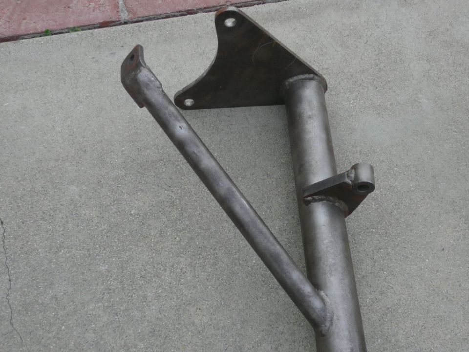 Metal bracket and tube assembly on concrete