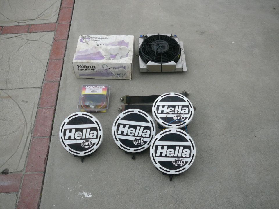 Four Hella lights, radiator fan, and Yukon box on pavement