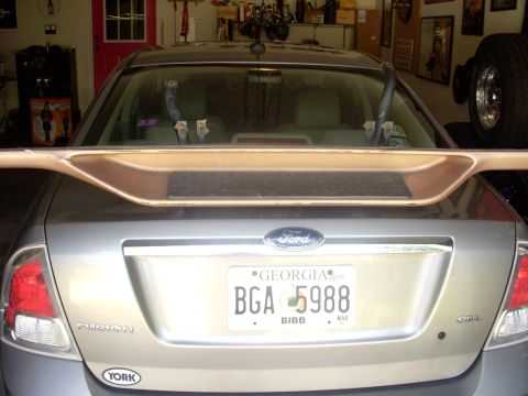 1993 Ford Bronco - Rear view of a silver sedan with a spoiler and a Georgia license plate.