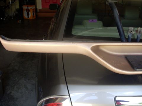 1993 Ford Bronco - Vehicle rear trim piece with interior visible through the window.