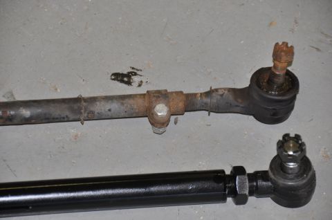 1996 Ford Bronco - Comparison of a worn tie rod with a new replacement part.