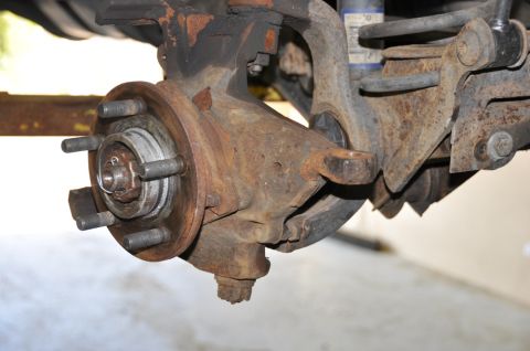 1996 Ford Bronco - This image shows a corroded vehicle suspension assembly, not a complete vehicle.