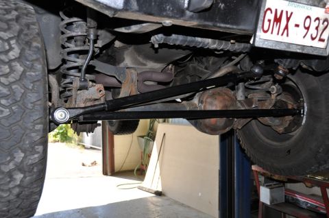 1996 Ford Bronco - Undercarriage view of a vehicle with visible suspension and steering components, including a Brunswick license plate.