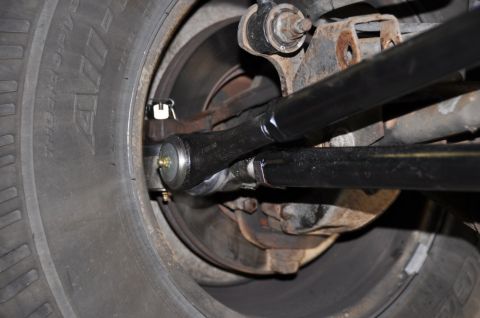 1996 Ford Bronco - Detail of the steering linkage and tire assembly, likely from a truck or SUV.