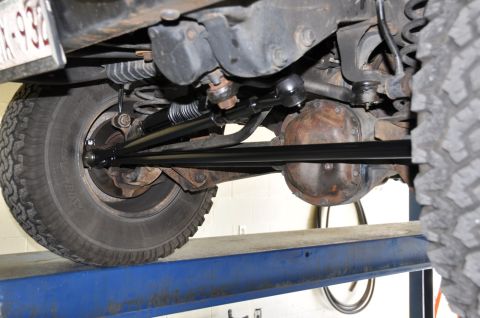 1996 Ford Bronco - Close-up view of the undercarriage and suspension components of a vehicle.